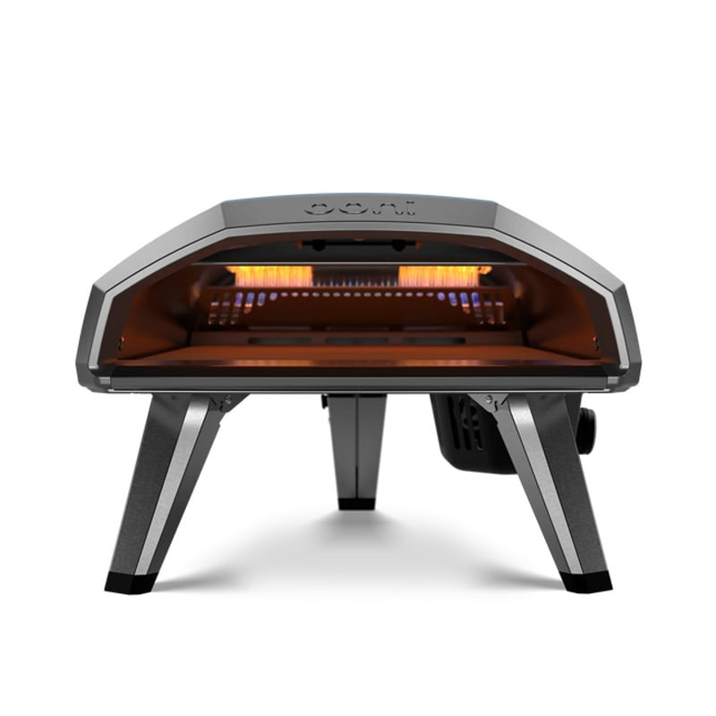 Four à pizza Ooni Koda 2 vue avant avec intérieur illuminé d'une lueur orange, brûleur à flamme visi